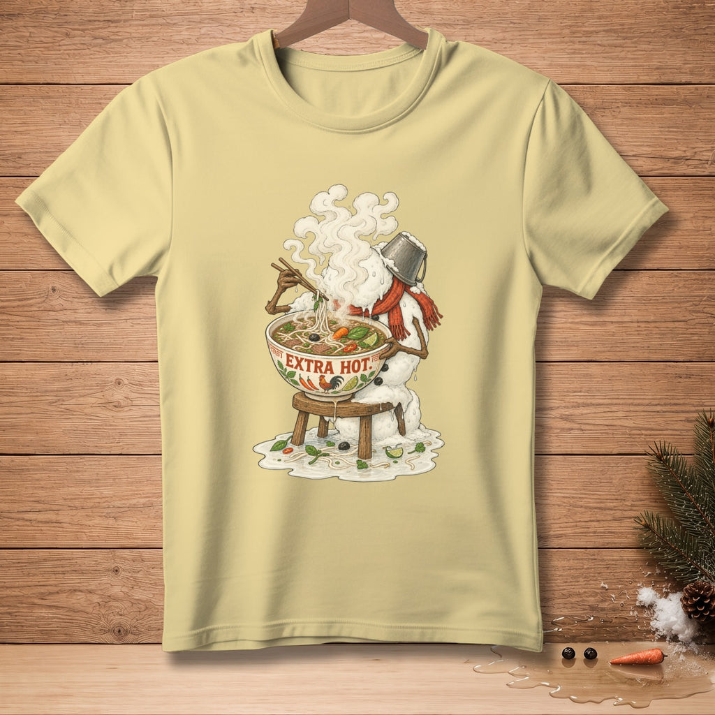 Light yellow t-shirt with a graphic of a melting snowman eating steaming pho, "EXTRA HOT." text.