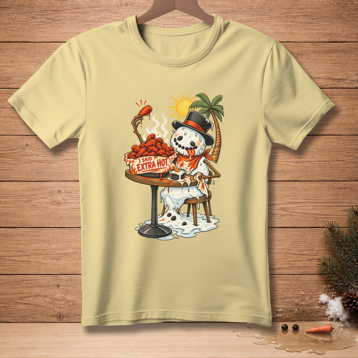 Melting snowman in a top hat eats spicy chicken wings, text reads "I said extra hot".