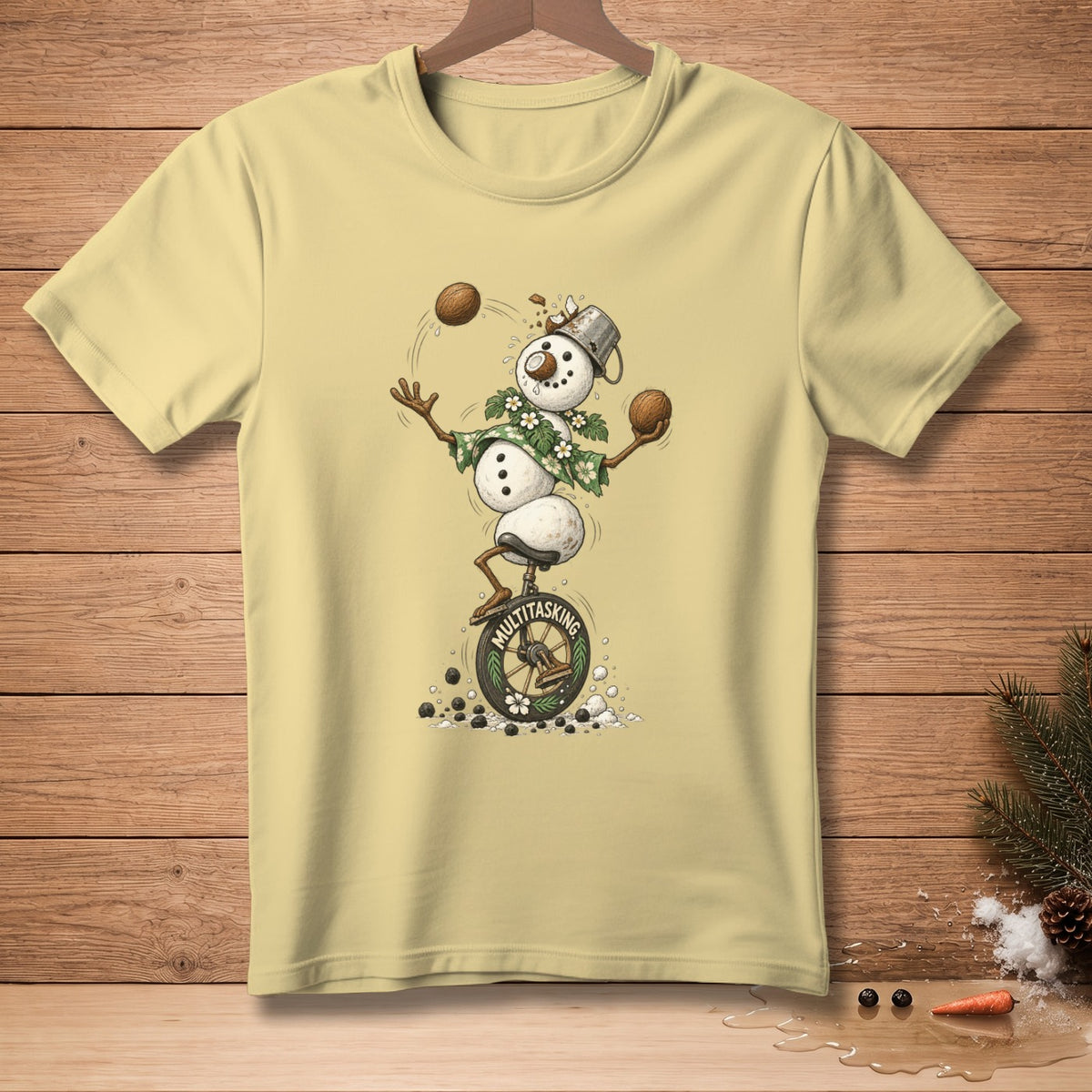 Snowman juggling coconuts while riding a unicycle with "MULTITASKING" on the wheel.