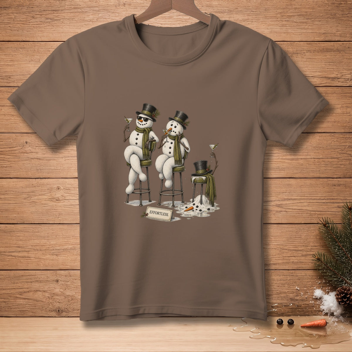 T-shirt with a graphic of two snowmen in hats and scarves, one melting.